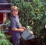 child with watering can